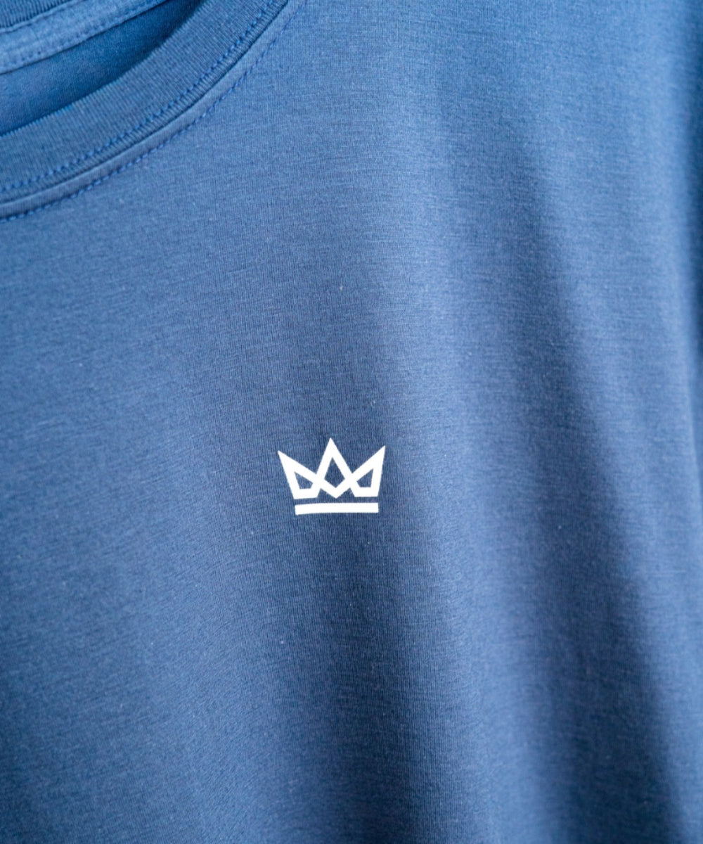 Blue t-shirt with a white crown logo on a blue background