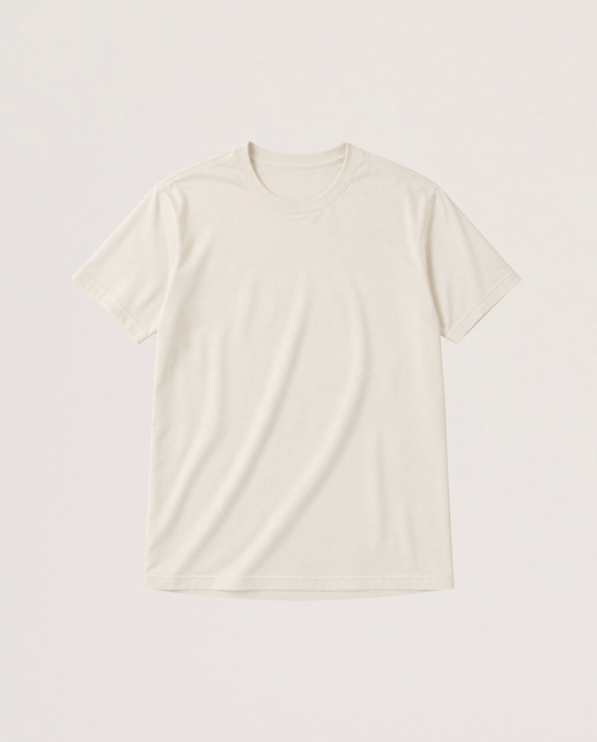 A plain short-sleeve crewneck t-shirt in a warm off-white or cream color, displayed flat against a matching light beige background.
