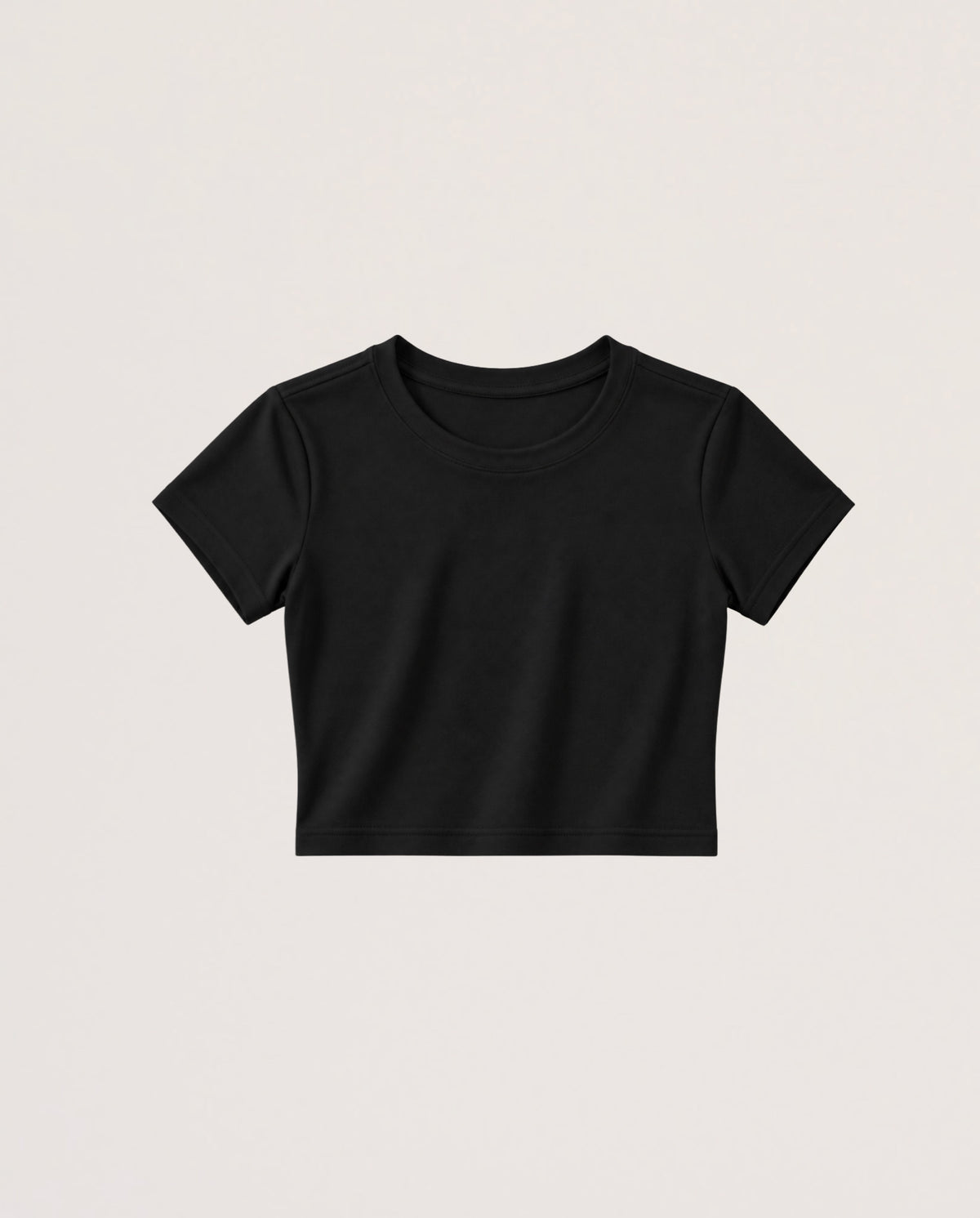 A black short-sleeve crop top t-shirt with a crew neck, displayed flat against a light beige background.
