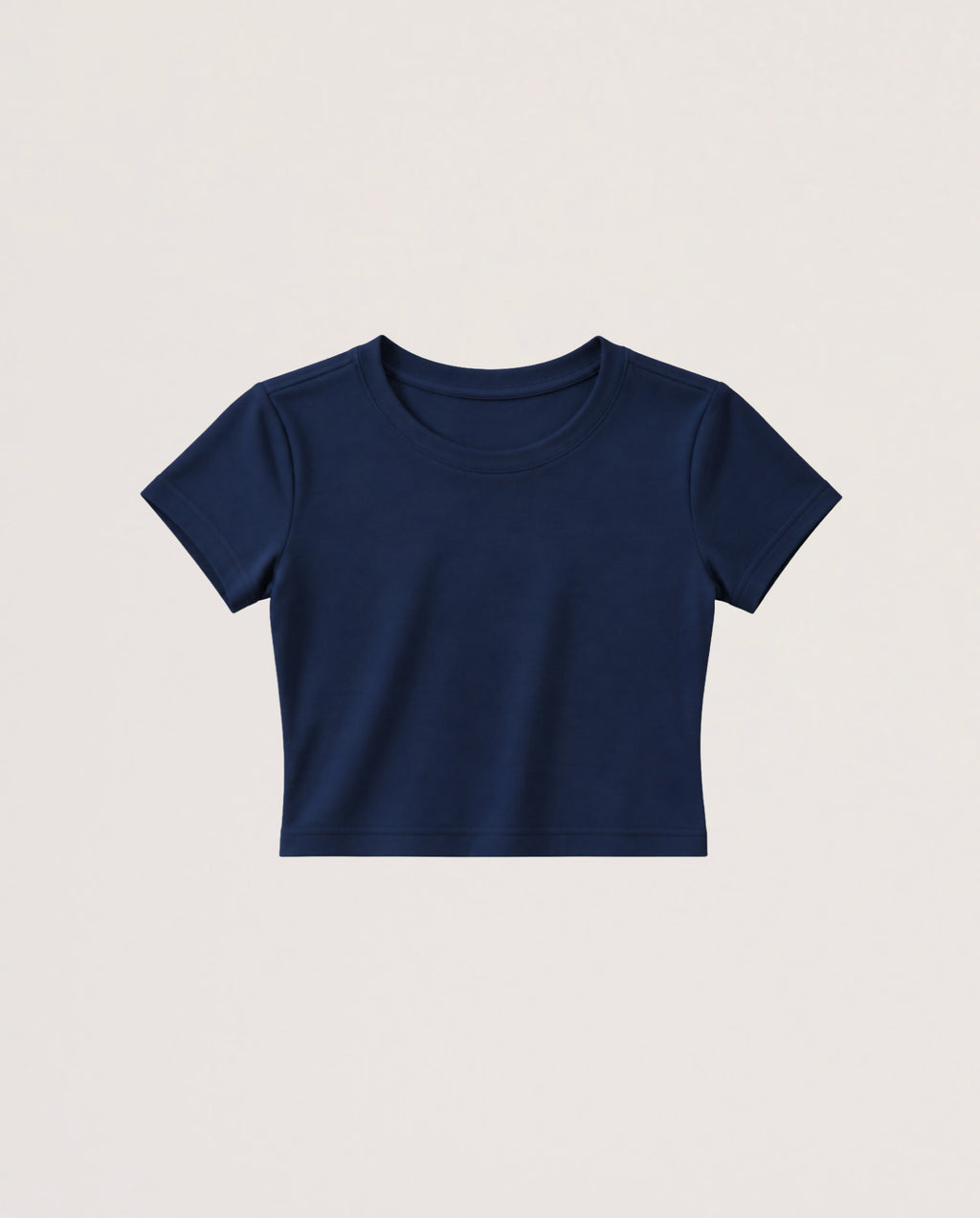 A navy blue short-sleeve crop top t-shirt displayed flat against a light beige background.