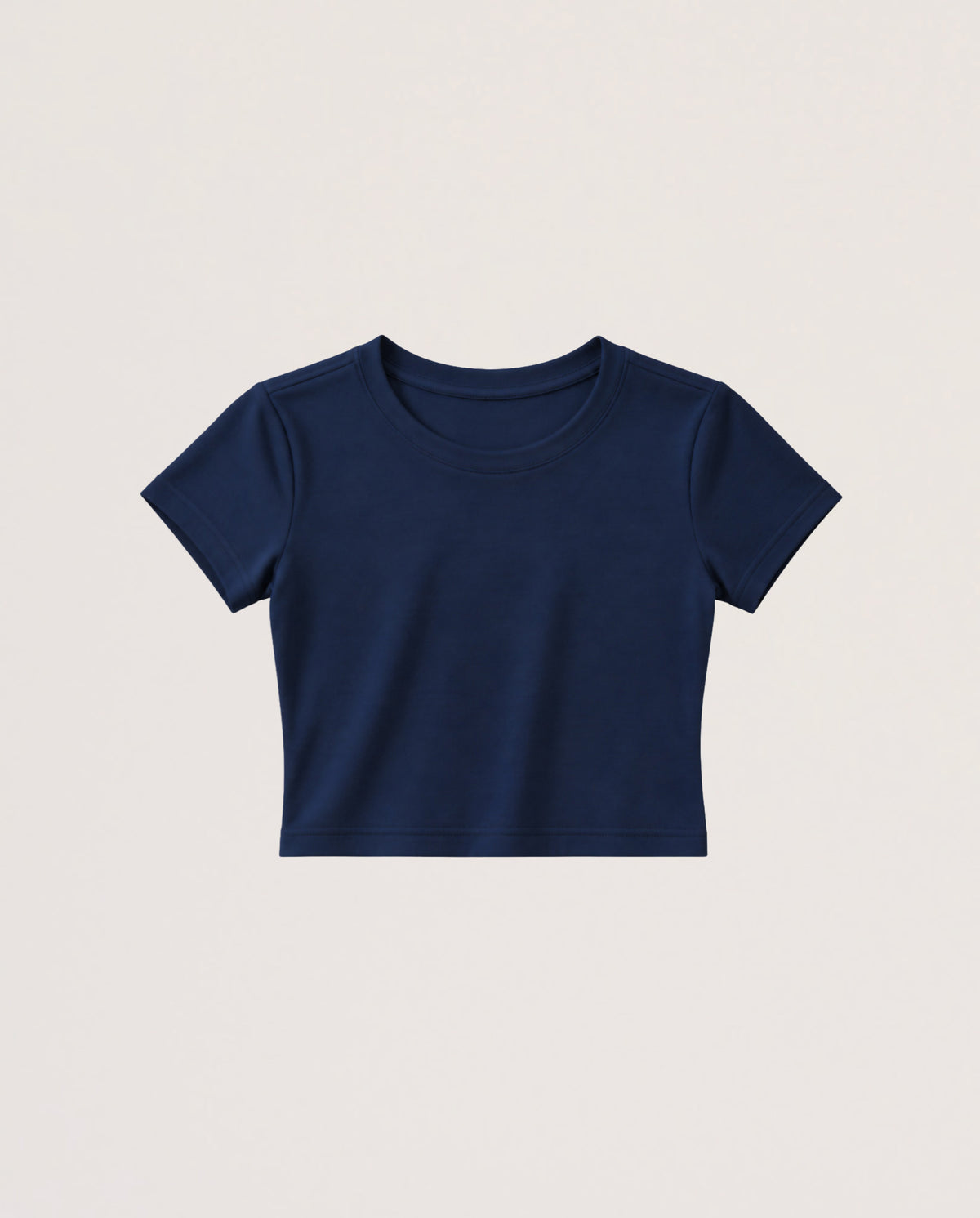 A navy blue short-sleeve crop top t-shirt displayed flat against a light beige background.