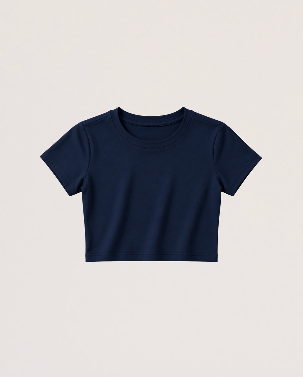 A navy blue short-sleeve crop top t-shirt displayed flat against a light beige background.