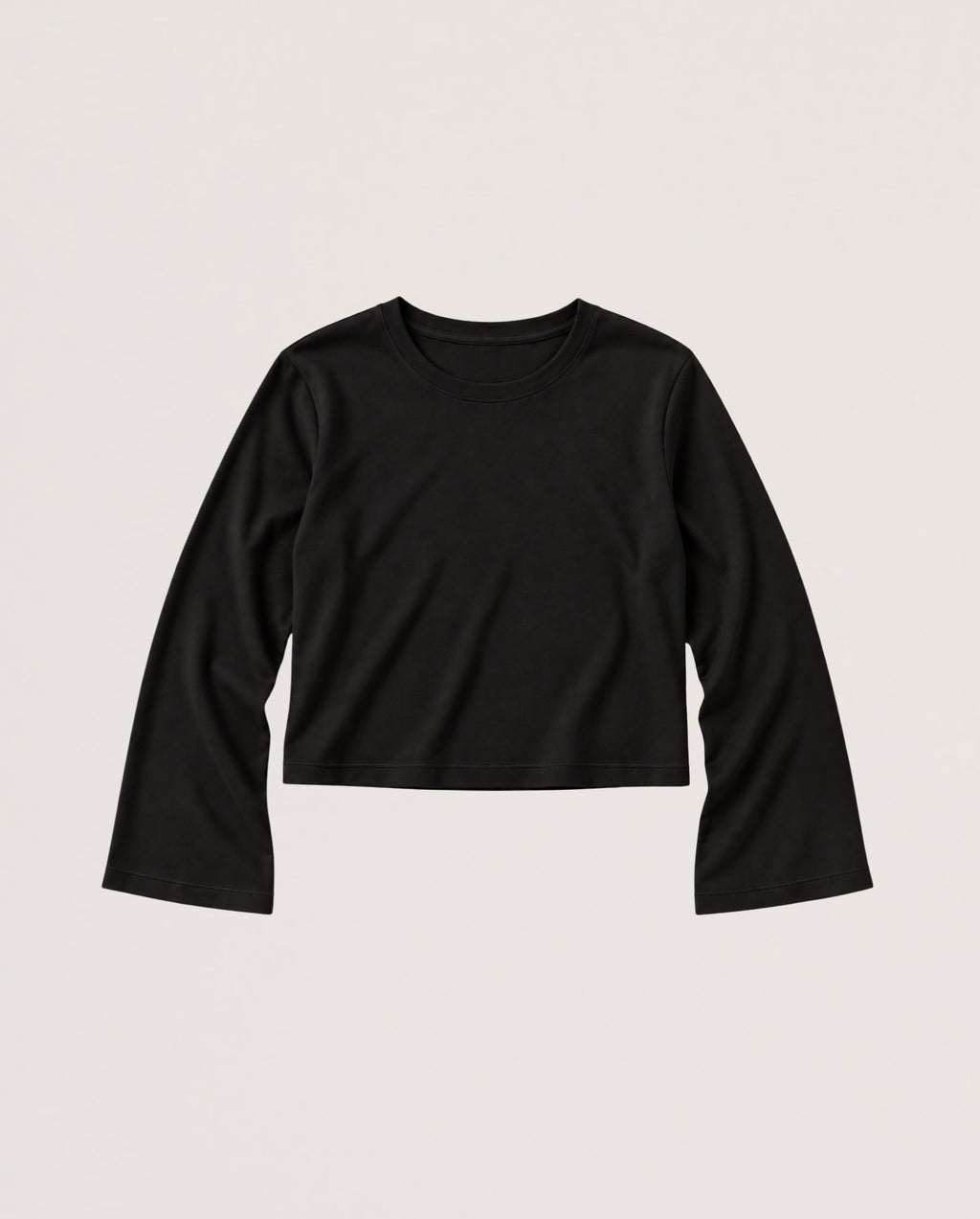 A black long-sleeve cropped t-shirt with a crew neck, laid flat against a light beige background.