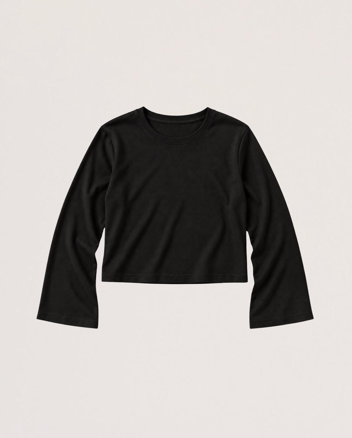 A black long-sleeve cropped t-shirt with a crew neck, laid flat against a light beige background.