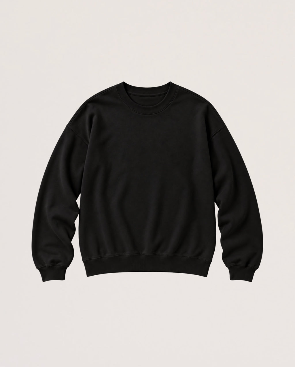 A plain black crewneck sweatshirt with long sleeves and ribbed cuffs and hem, displayed flat against a light beige background.