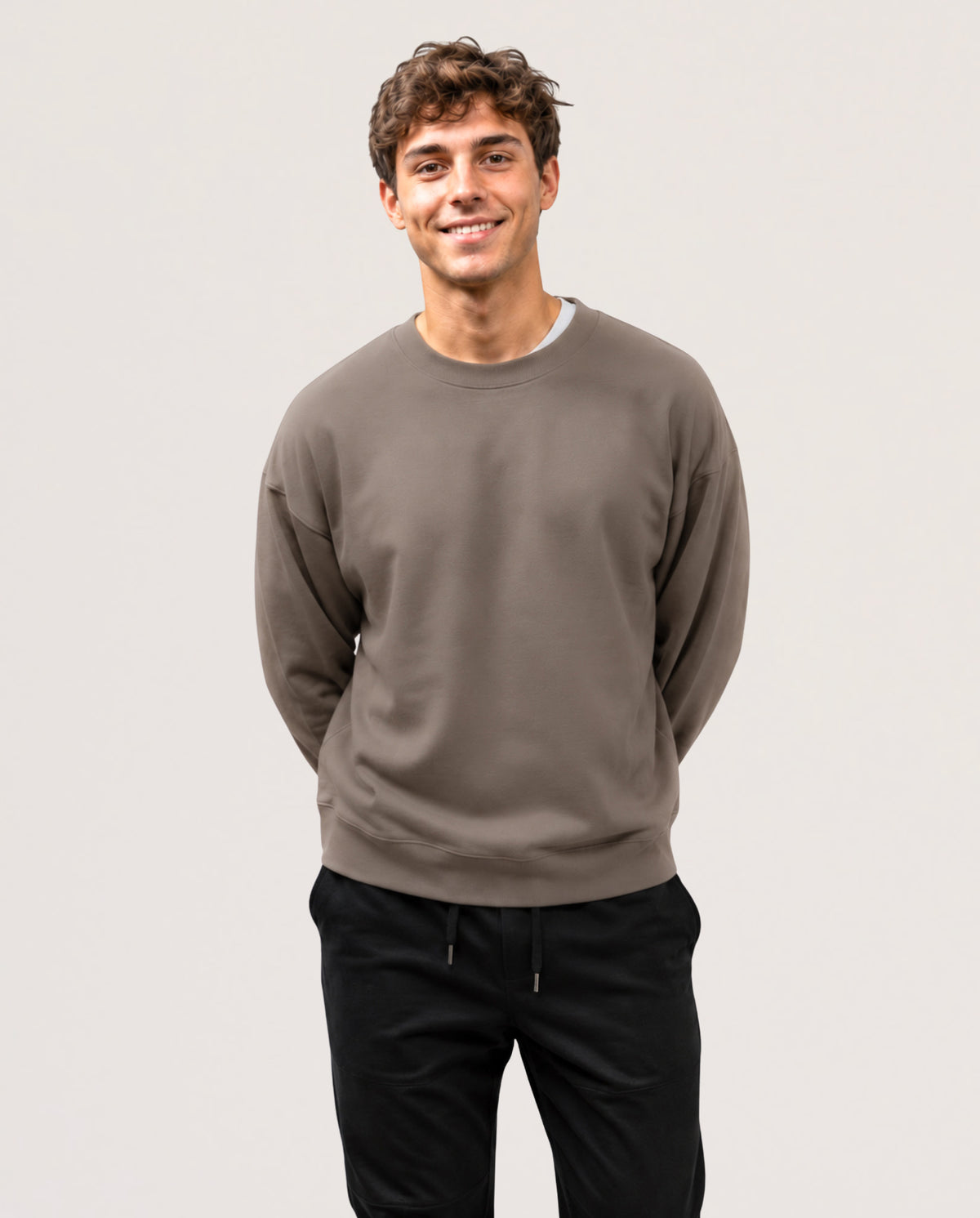 A model is wearing a long sleeve shirt in Espresso